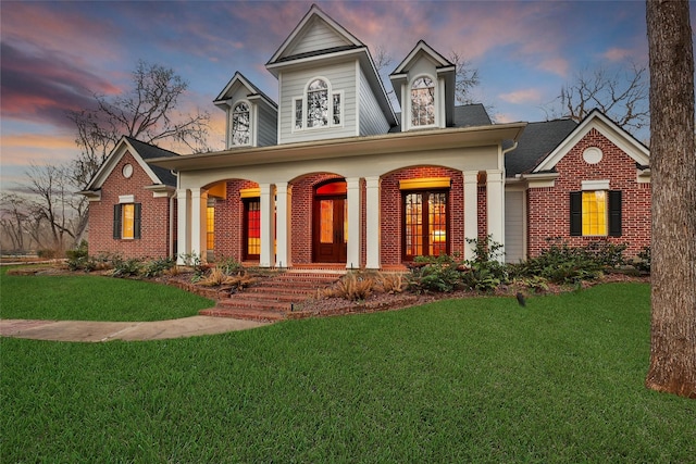 view of front facade featuring a yard and covered porch