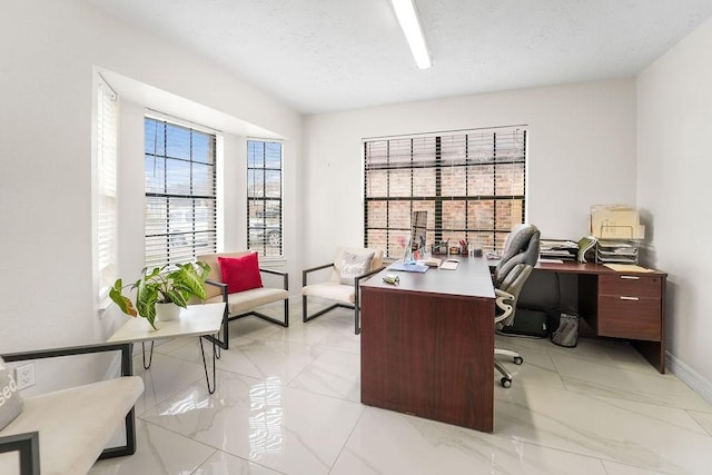 home office featuring a textured ceiling