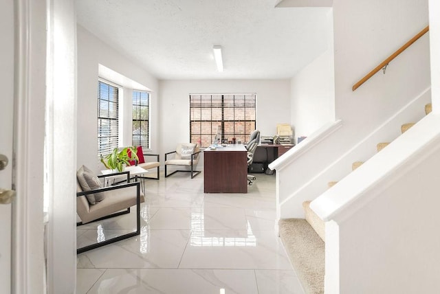 interior space with a textured ceiling