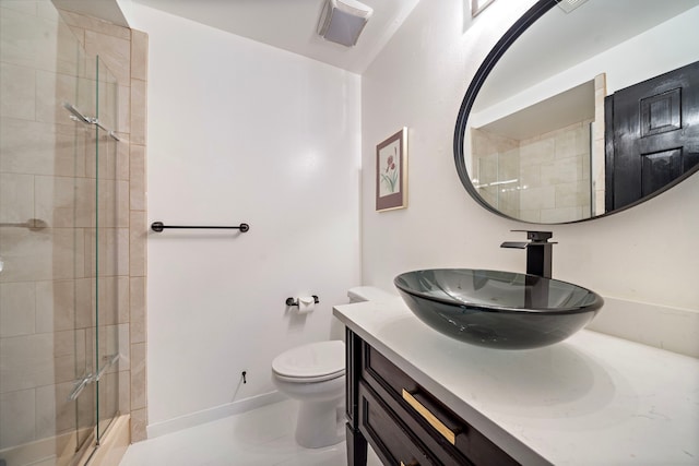 bathroom featuring walk in shower, vanity, and toilet