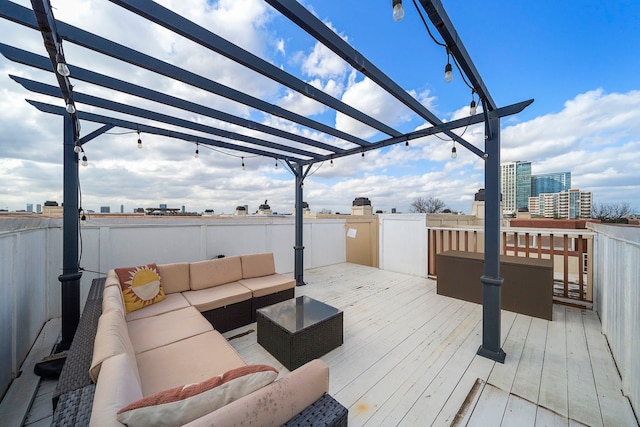 wooden terrace with outdoor lounge area and a pergola