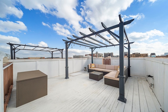 wooden deck featuring a pergola and outdoor lounge area