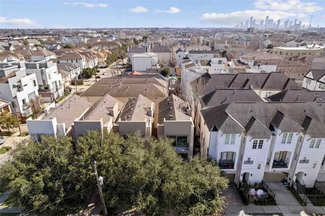 birds eye view of property with a residential view