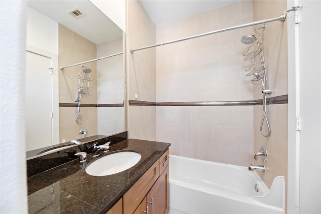 full bath with visible vents, tub / shower combination, and vanity