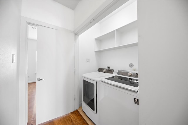 laundry room with laundry area, light wood-style flooring, and independent washer and dryer