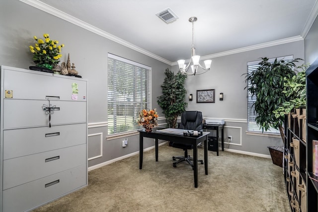 carpeted office space featuring ornamental molding and a chandelier