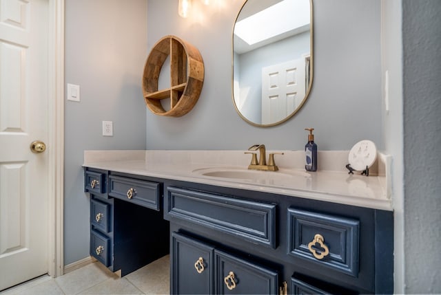 bathroom with vanity and tile patterned flooring