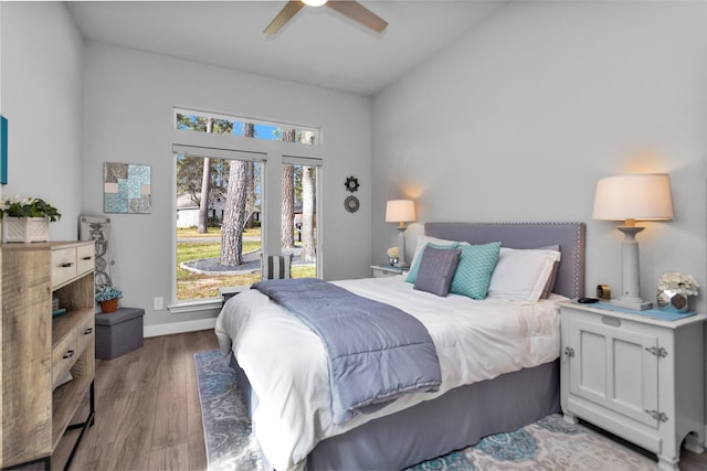 bedroom with hardwood / wood-style flooring, access to exterior, and ceiling fan