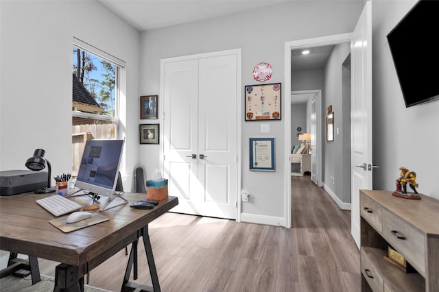 home office featuring light hardwood / wood-style flooring