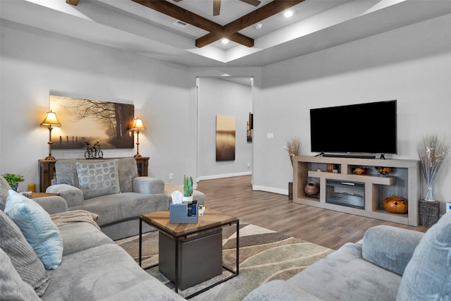 living room featuring hardwood / wood-style flooring, coffered ceiling, and beam ceiling