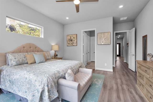 bedroom with ceiling fan and light wood-type flooring