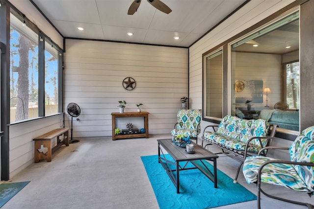 sunroom / solarium with ceiling fan