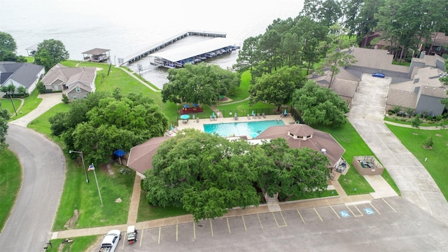 birds eye view of property with a water view