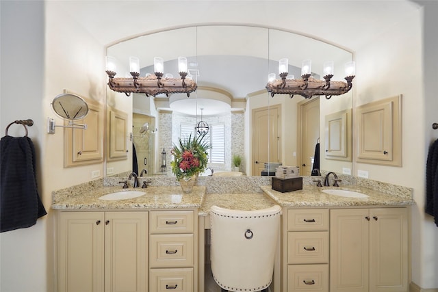 bathroom featuring a shower stall and vanity