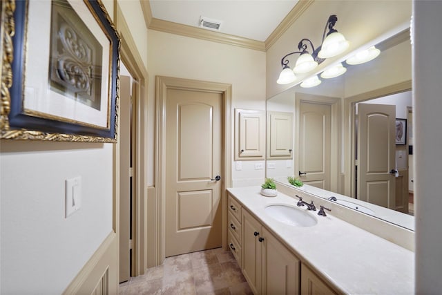 bathroom with visible vents, vanity, and crown molding