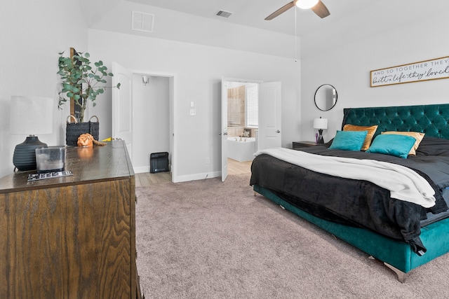 bedroom featuring ceiling fan, ensuite bath, and carpet flooring