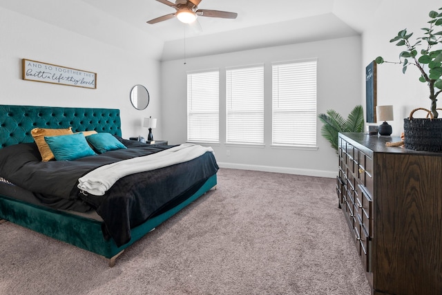 carpeted bedroom featuring ceiling fan and lofted ceiling