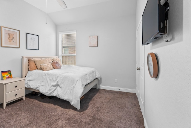 carpeted bedroom featuring vaulted ceiling and ceiling fan