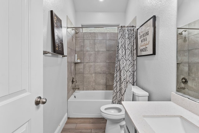 full bathroom featuring vanity, hardwood / wood-style floors, shower / bathtub combination with curtain, and toilet