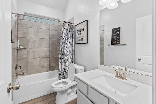 full bathroom with vanity, hardwood / wood-style floors, toilet, and shower / bath combo with shower curtain