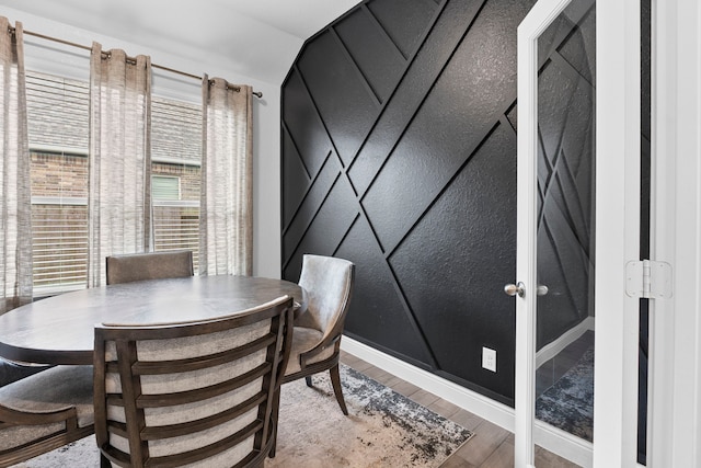 dining area with hardwood / wood-style flooring