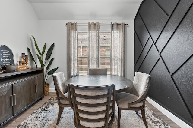 dining room featuring a healthy amount of sunlight and light wood-type flooring