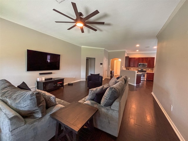 living room featuring ornamental molding, ceiling fan, and dark hardwood / wood-style flooring