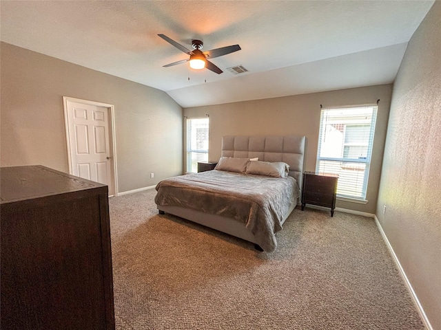 carpeted bedroom with ceiling fan and lofted ceiling