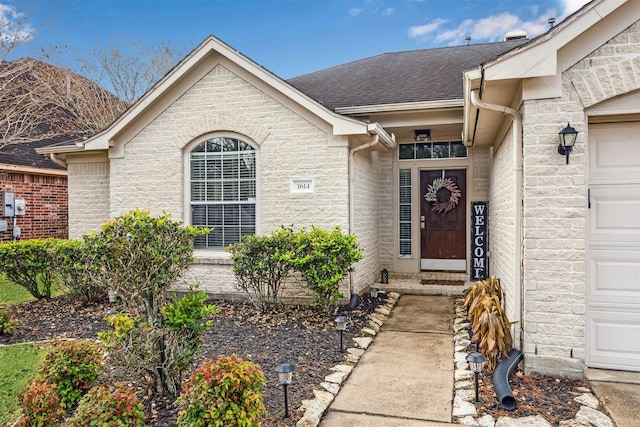 property entrance with a garage