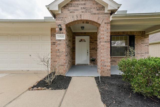 view of exterior entry featuring a garage