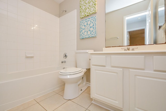 full bathroom featuring vanity, tile patterned floors, toilet, and tiled shower / bath