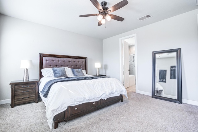 carpeted bedroom with connected bathroom and ceiling fan