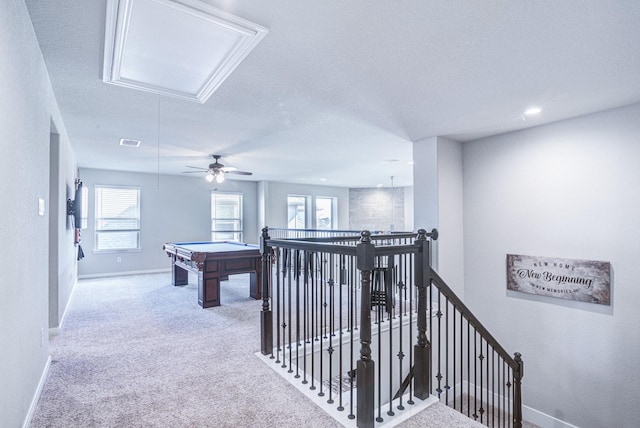 playroom featuring carpet flooring and a textured ceiling