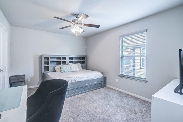 carpeted bedroom featuring ceiling fan