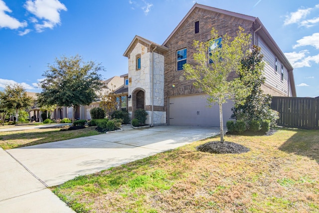 view of front of house with a garage and a front lawn