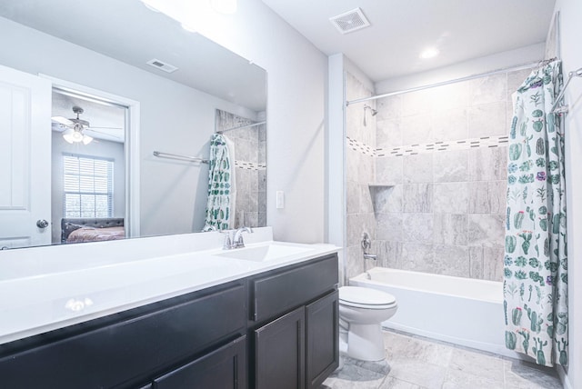 full bathroom featuring vanity, ceiling fan, toilet, and shower / bathtub combination with curtain