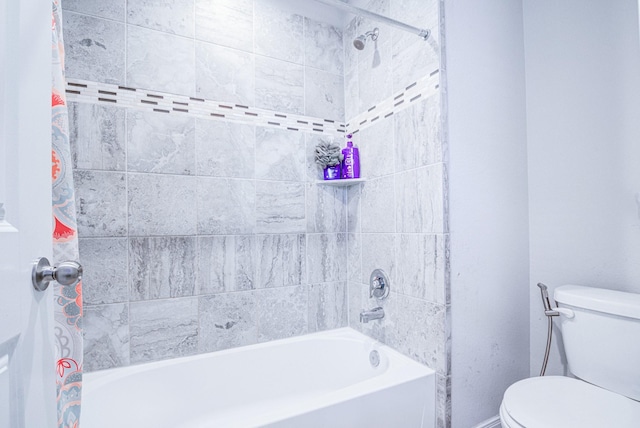 bathroom with shower / tub combo with curtain and toilet