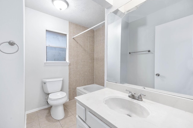 full bathroom with vanity, a textured ceiling, tile patterned floors, toilet, and tiled shower / bath