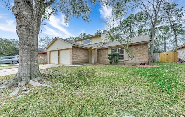 view of property with a garage and a front yard