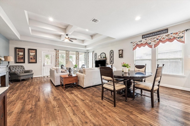 dining room featuring coffered ceiling, plenty of natural light, and dark wood-type flooring