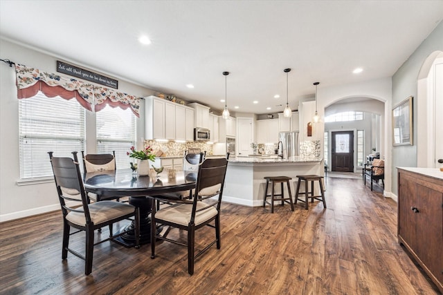 dining room with dark wood-type flooring