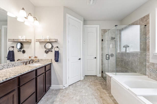 full bath with baseboards, a garden tub, a shower stall, and vanity