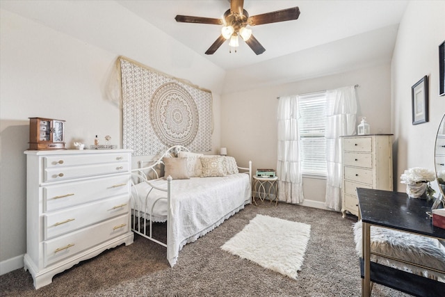 carpeted bedroom featuring lofted ceiling and ceiling fan