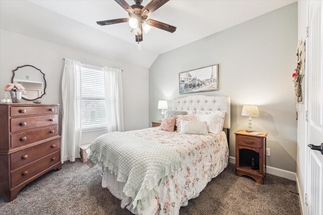 bedroom featuring dark carpet, ceiling fan, and vaulted ceiling