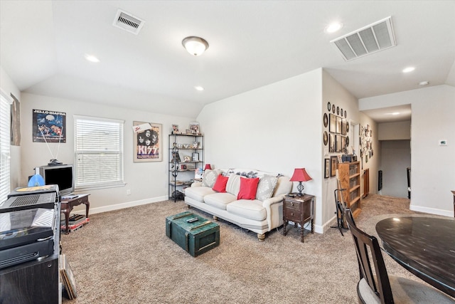 living room featuring vaulted ceiling and carpet flooring