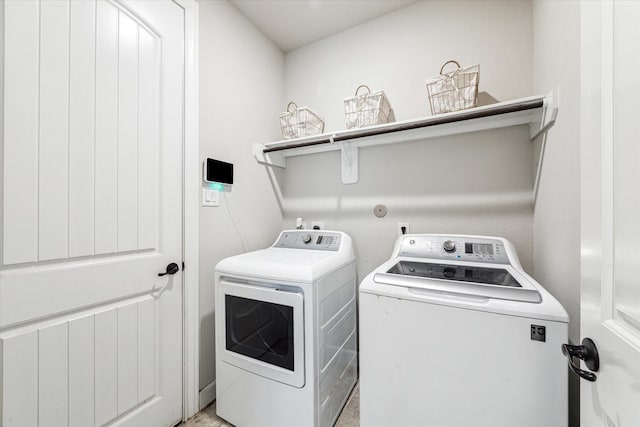 clothes washing area with laundry area and washing machine and dryer