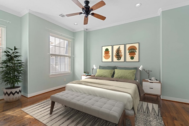 bedroom with ceiling fan, ornamental molding, dark hardwood / wood-style floors, and multiple windows