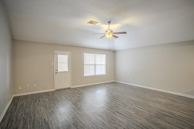 unfurnished room featuring dark hardwood / wood-style floors and ceiling fan