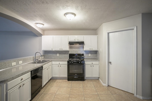 kitchen featuring sink, light tile patterned floors, white cabinetry, black appliances, and decorative backsplash