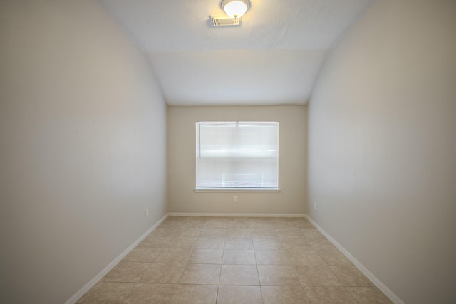 empty room featuring light tile patterned flooring